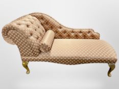 A contemporary chaise longue, length 136cm.