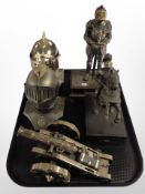 A decorative model cannon on carriage, together with two figures of knights and two similar busts.