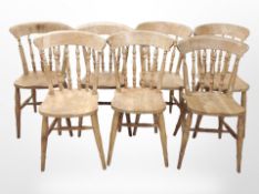 A set of seven pine spindle-back dining chairs.