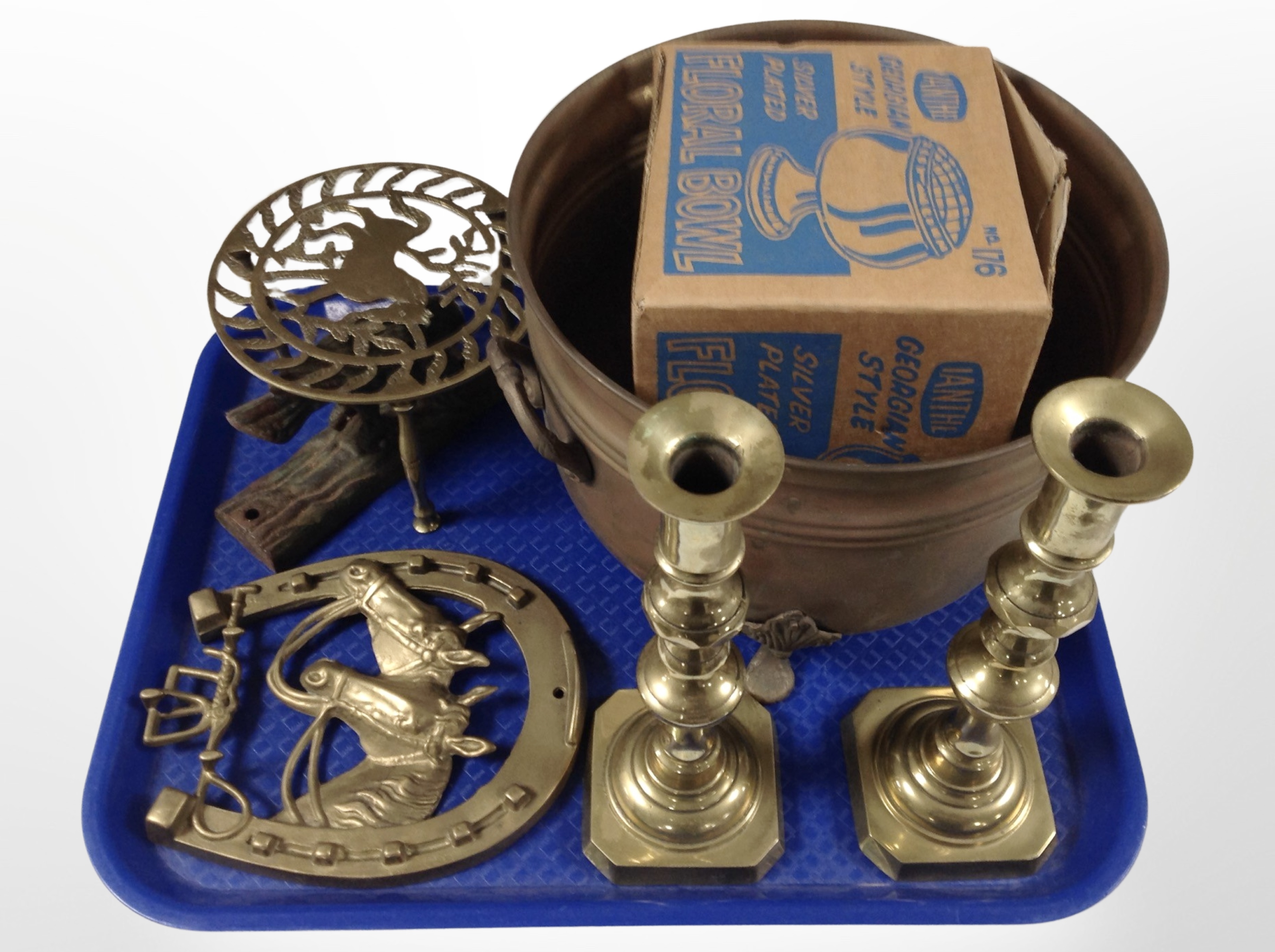 A 19th-century brass planter together with a pair of candlesticks, trivet,