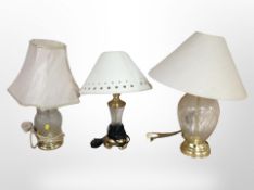 Three contemporary brass and glass table lamps, tallest 47cm.