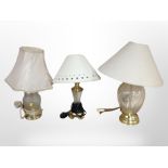 Three contemporary brass and glass table lamps, tallest 47cm.