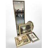 A rectangular gilt-framed mirror, 126cm x 35cm, together with a further oval mirror,