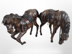 Two leather figures of horses, height 22cm.