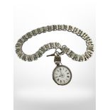 A continental silver fob watch upon an ornate fancy-link chain