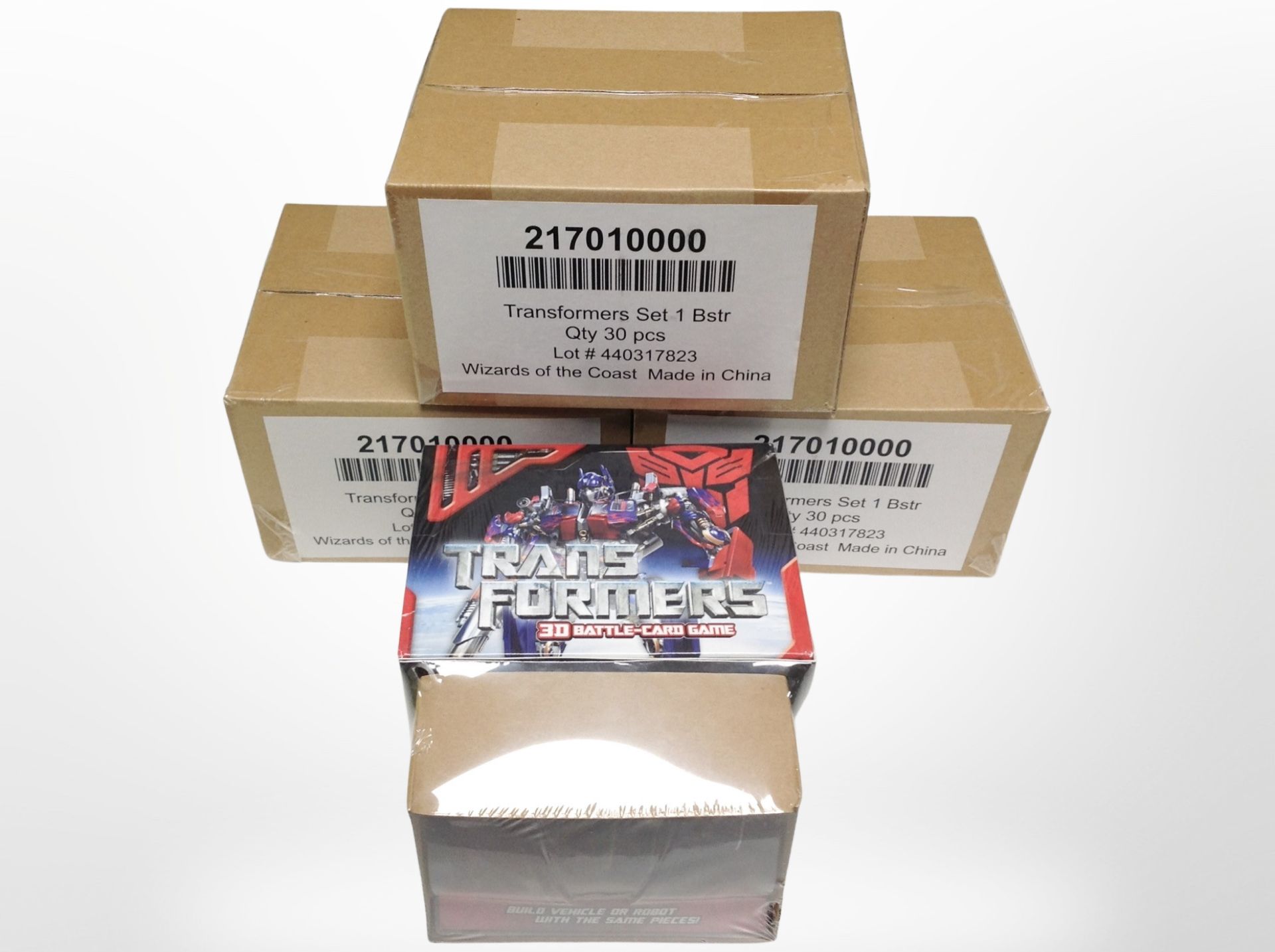 Four Transformers 3D Battle Card games, sealed, each with a related Transformers model.