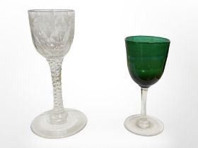An 18th century twist-stem wine glass etched with grape and leaf motif,