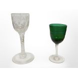 An 18th century twist-stem wine glass etched with grape and leaf motif,