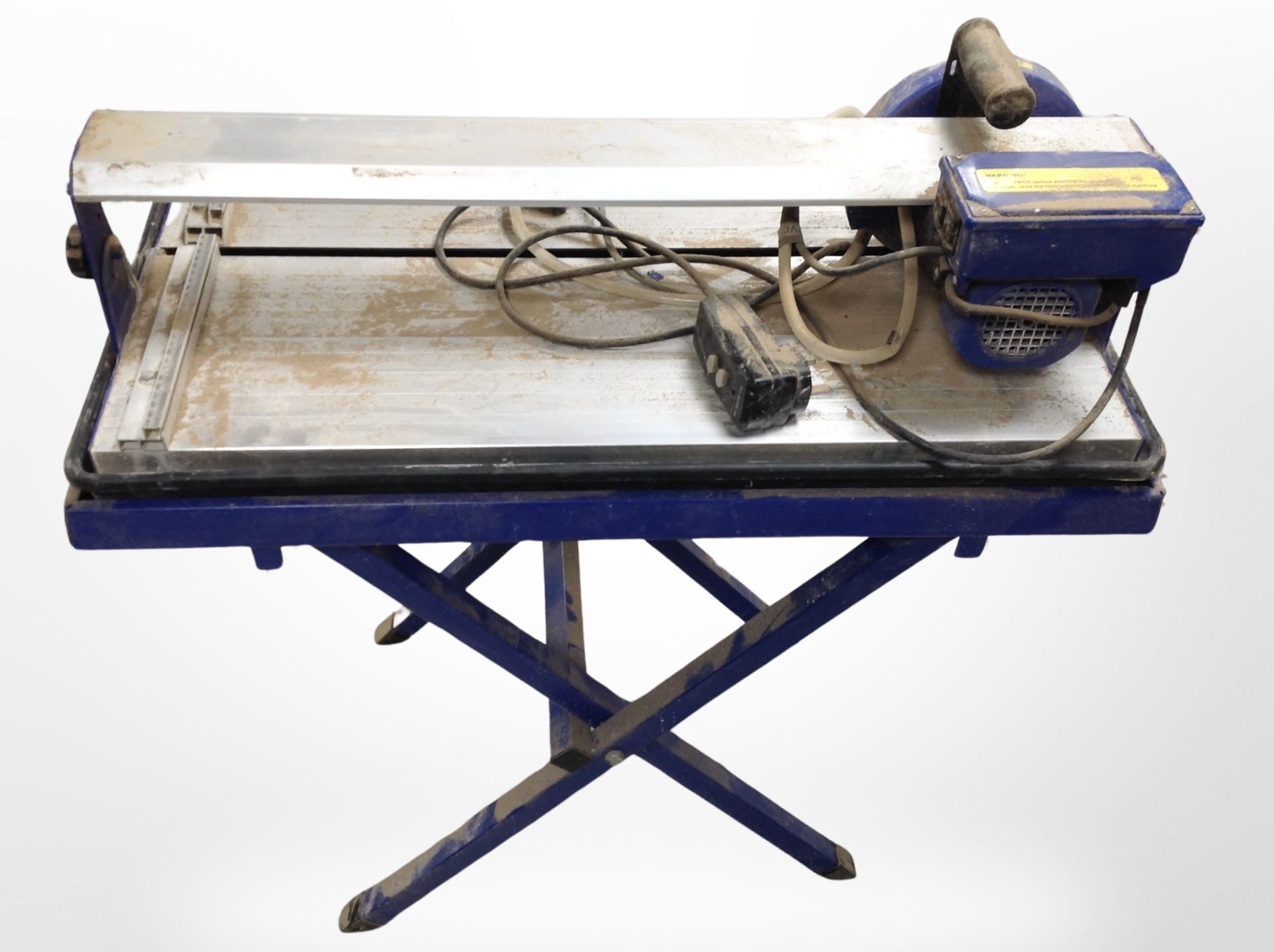 A 600 Watt bridge saw tile cutter.