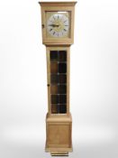 A Danish blonde oak long case clock with brass and silvered dial, with pendulum and weights,