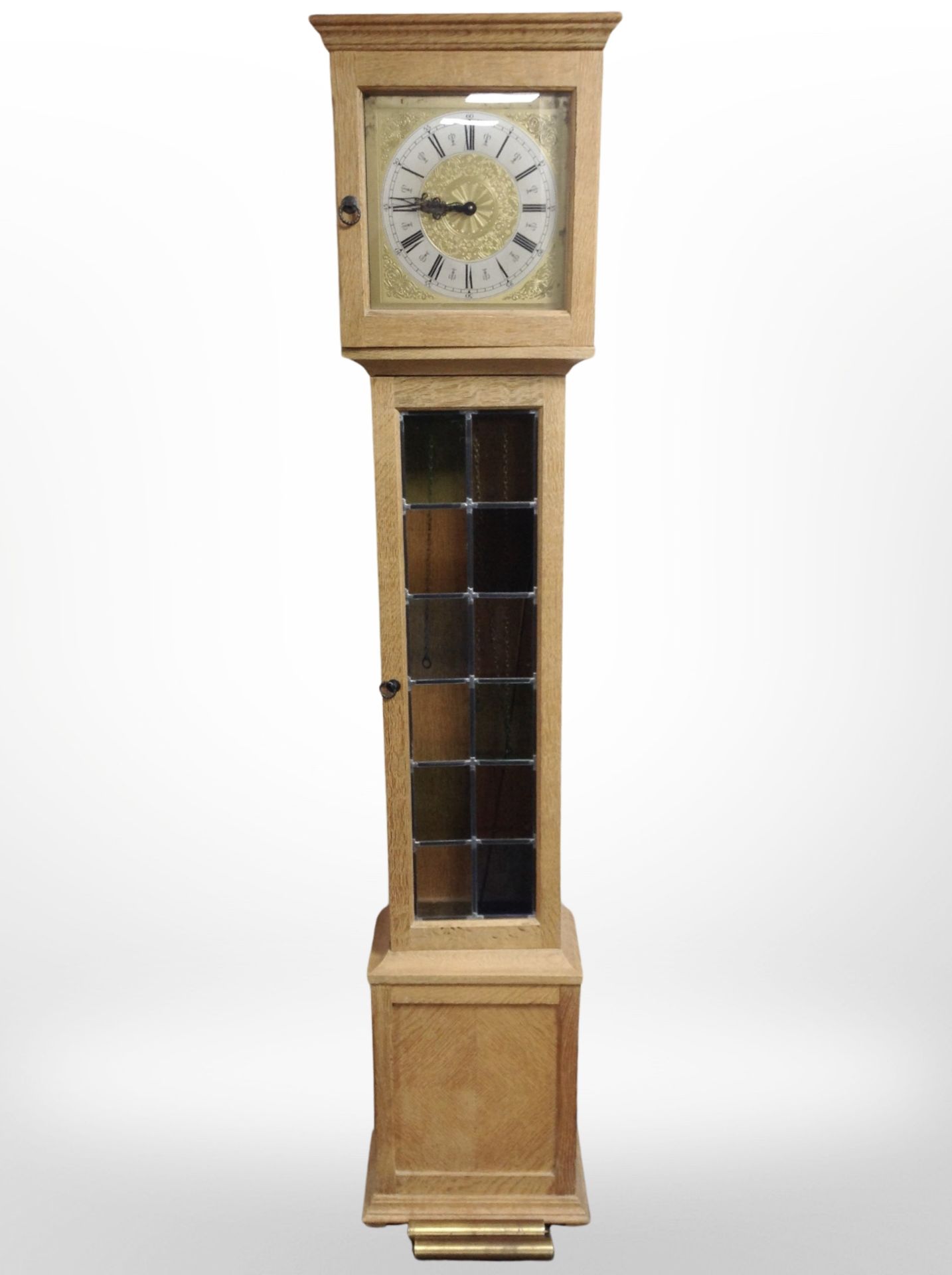 A Danish blonde oak long case clock with brass and silvered dial, with pendulum and weights,