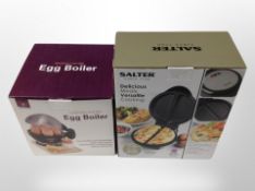 A Salter omelette maker and an Andrew James egg boiler in boxes.
