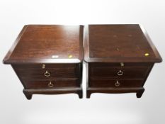 A pair of Stag two-drawer bedside chests, width 53cm.