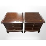 A pair of Stag two-drawer bedside chests, width 53cm.