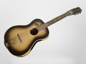 A mid-20th century Martin Coletti blues-style acoustic guitar with soft carry bag.
