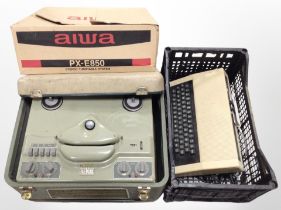 A Revox reel-to-reel player, an Aiwa turntable in box, and an Acorn Atom computer keyboard.