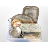 A box containing silver-plated serving trays, hors d'oeurve dish,