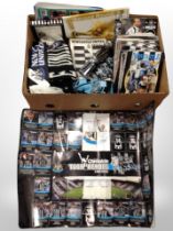 A box of Newcastle United match day programmes, scarves and related ephemera.