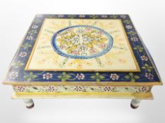 A square painted meditation table, width 45cm.