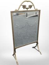 A brass and bevelled glass mirrored fire screen, height 80cm.