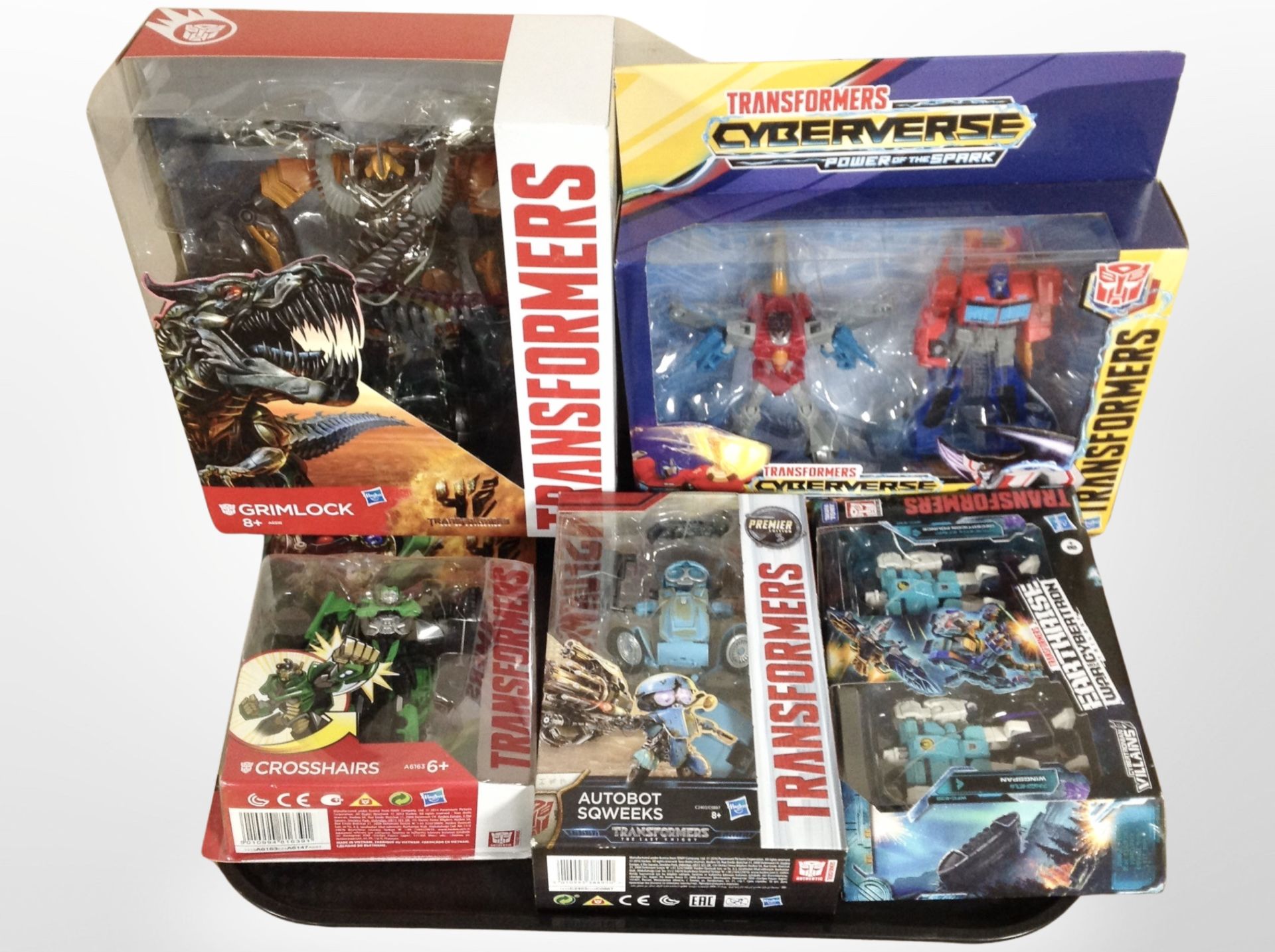 Five Hasbro Transformers figures, boxed.