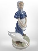 A Royal Copenhagen figure of a girl and a goose, height 24cm.