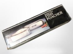 A stainless steel fish poacher in box.