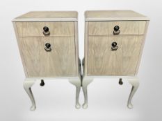 A pair of bleached walnut bedside cabinets on cabriole legs, 42cm wide x 34cm deep x 75cm high.