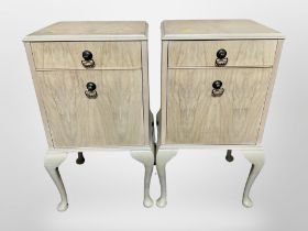 A pair of bleached walnut bedside cabinets on cabriole legs, 42cm wide x 34cm deep x 75cm high.