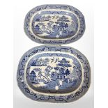 A pair of 19th-century Staffordshire blue and white willow pattern meat plates, width 40cm.