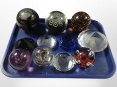 A group of glass paperweights including Caithness.