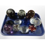 A group of glass paperweights including Caithness.