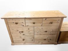 A contemporary pine seven-drawer chest, 134cm wide x 44cm deep x 85cm high.