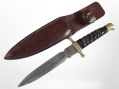 A brass-mounted knife in leather sheath with 14cm blade.