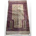 A Balouch prayer rug, Afghanistan, 130cm x 76cm.