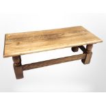 A reproduction oak refectory coffee table, 131cm long x 60cm wide x 46cm high.