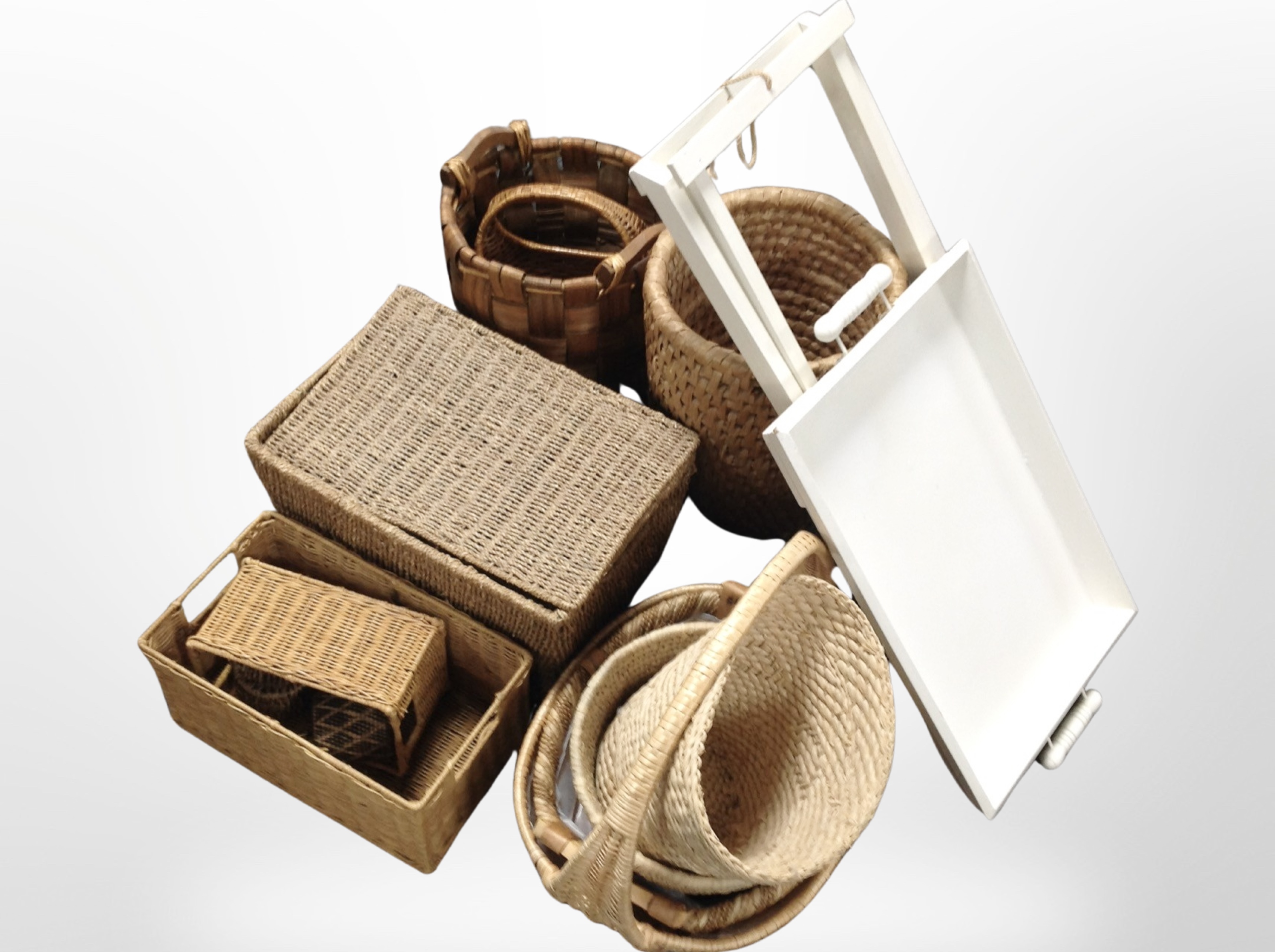 A group of wicker baskets, painted butler's serving tray on folding stand.