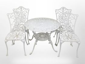 A painted cast-aluminium circular garden table, diameter 86cm, and a matching set of four chairs.