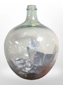 A large glass carboy, height 57cm.