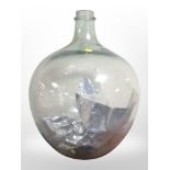 A large glass carboy, height 57cm.