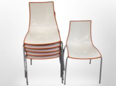 A set of 13 plastic stackable chairs on chrome legs.