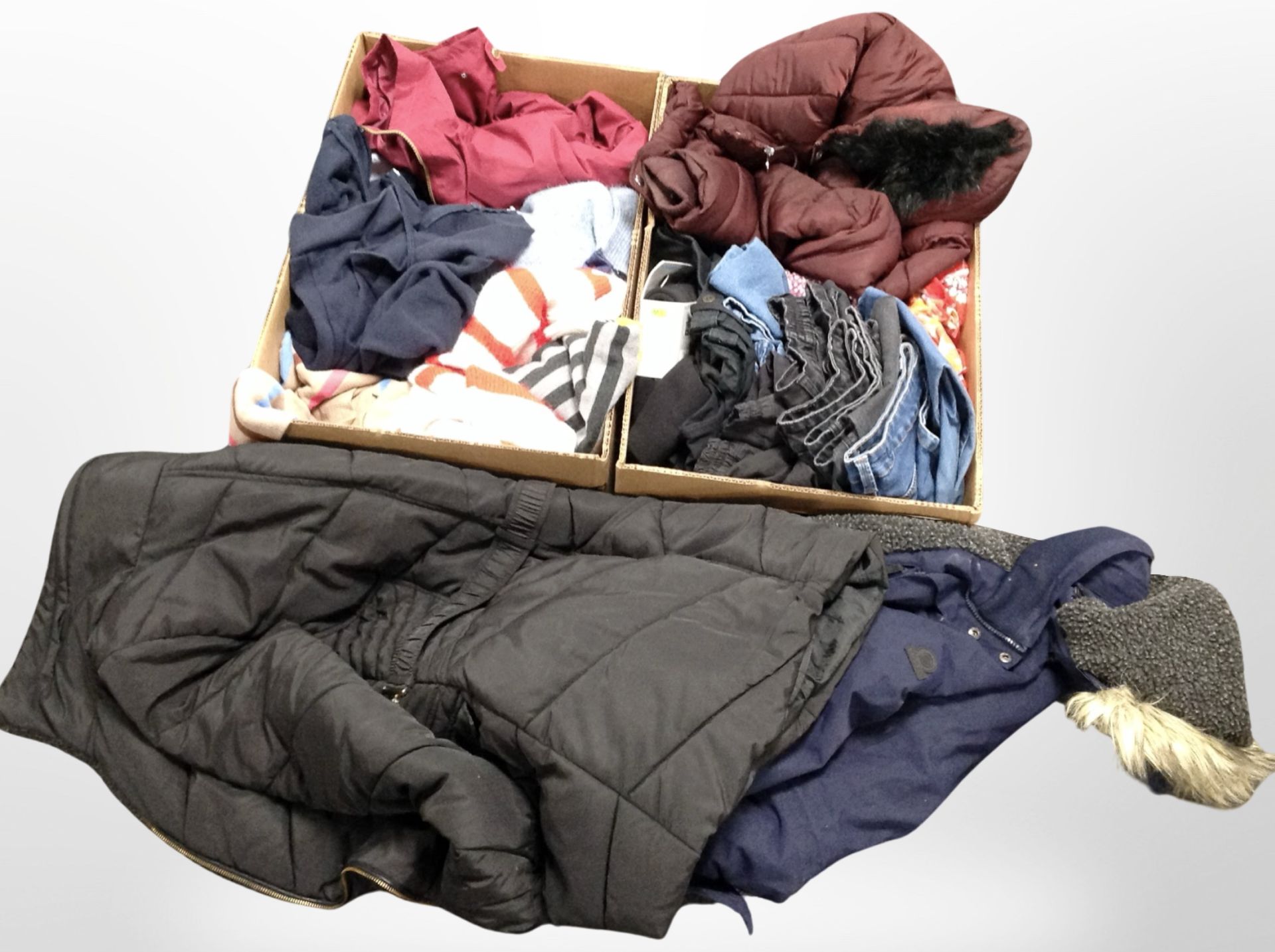 Two boxes containing assorted clothing, jeans, outdoor coats, etc.