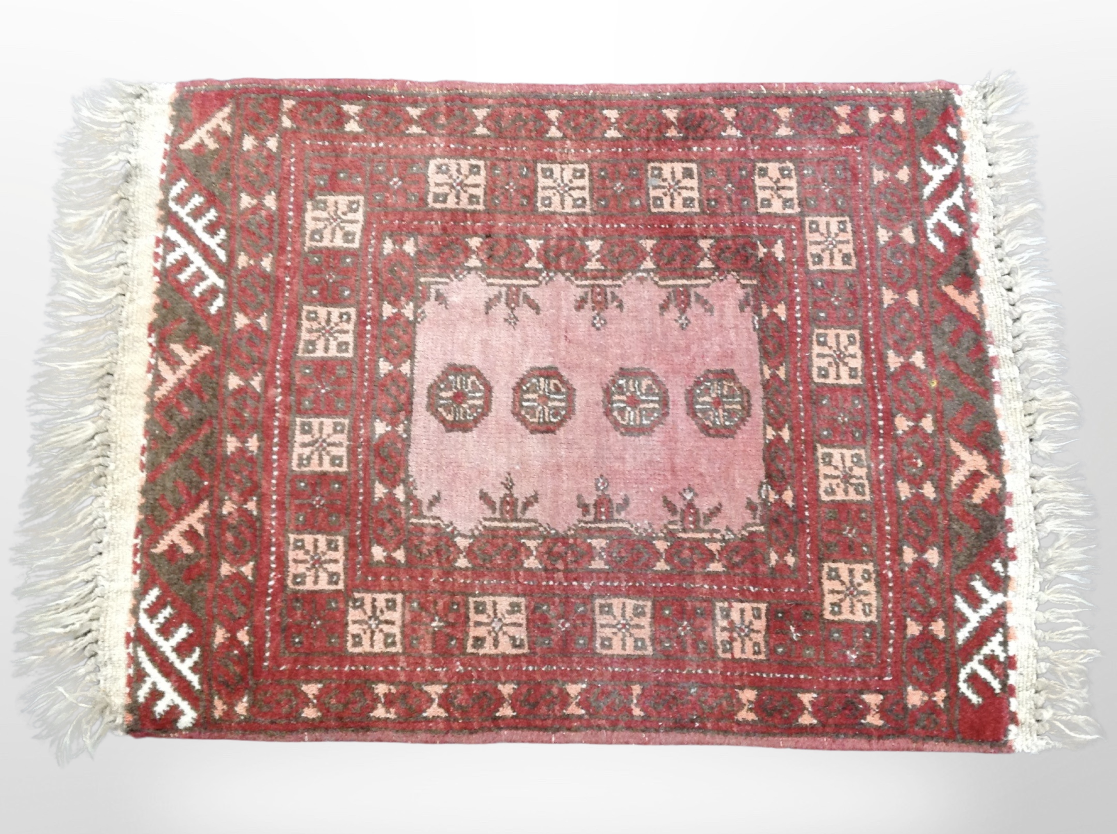 A Bokhara rug, Afghanistan, 86cm x 58cm.