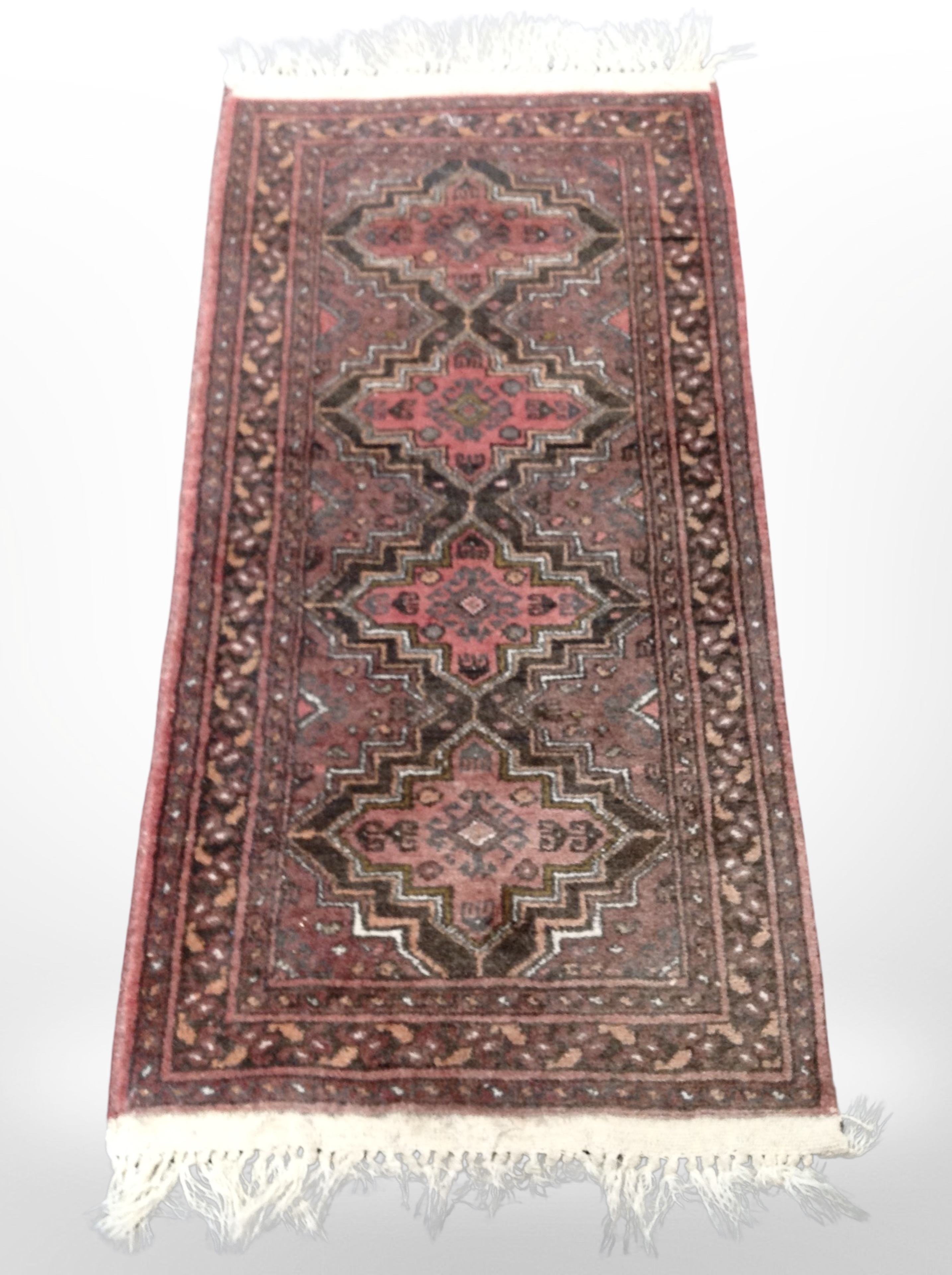 A Bokhara rug, Afghanistan, 116cm x 52cm.