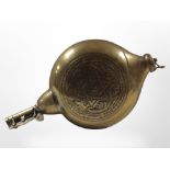 An Islamic brass moon-shaped powder flask, length 25cm.