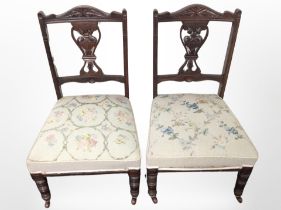 A pair of late Victorian mahogany salon chairs with embroidered seats.