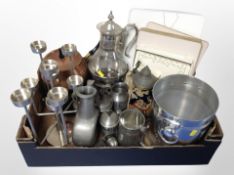 A box of stainless steel candleabrum, further ice bucket, pewter tankards, glass and EPNS ewer,