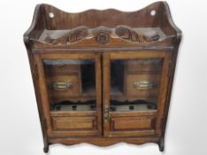 A Victorian oak double door smoker's cabinet,