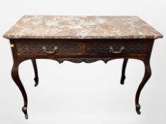 A Victorian carved mahogany marble topped wash stand fitted two drawers,