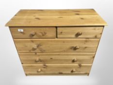 A contemporary pine and ply wood four drawer chest,